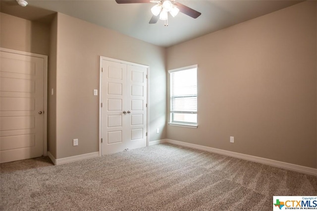 1018 Winchester Dr, Nolanville, TX 76559 - unfurnished bedroom featuring carpet flooring, baseboards, and a ceiling fan