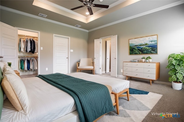 1018 Winchester Dr, Nolanville, TX 76559 - carpeted bedroom with a raised ceiling, crown molding, a walk in closet, baseboards, and a closet