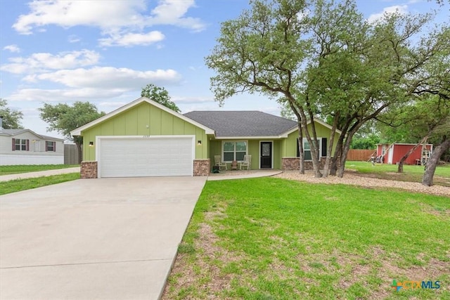 3299 Lake Park Rd, Belton, TX 76513 - ranch-style house featuring a garage, a front lawn, brick siding, board and batten siding, and driveway