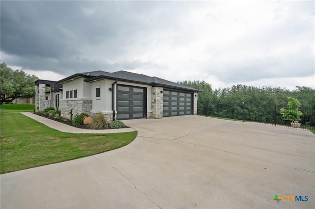 view of home's exterior featuring a garage, fence, stone siding, stucco siding, and concrete driveway