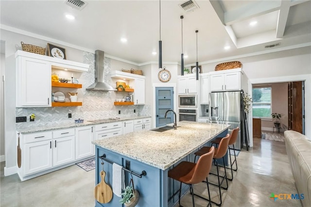 kitchen featuring visible vents, open shelves, wall chimney range hood, concrete floors, and appliances with stainless steel finishes