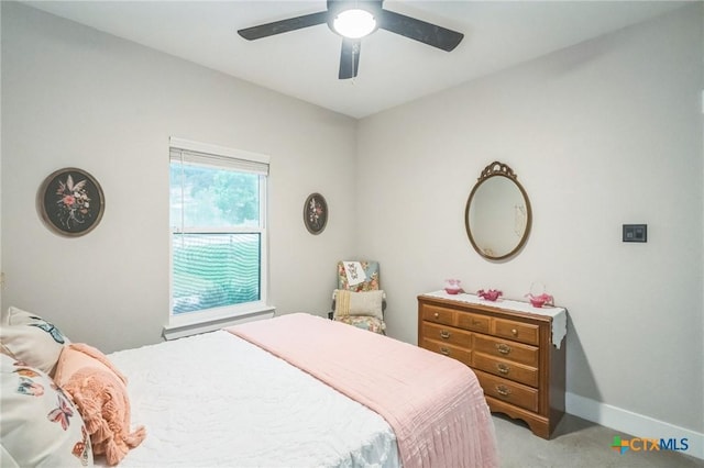 bedroom with baseboards, carpet, and a ceiling fan