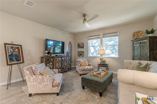 living room featuring ceiling fan