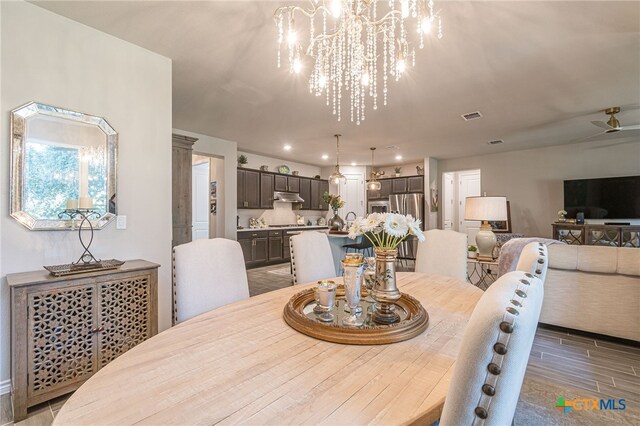 dining space with wood-type flooring