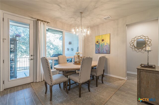 dining area with a notable chandelier