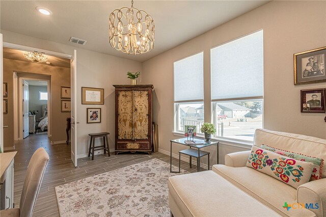 sitting room featuring a chandelier