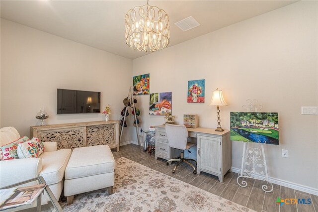 office area featuring an inviting chandelier