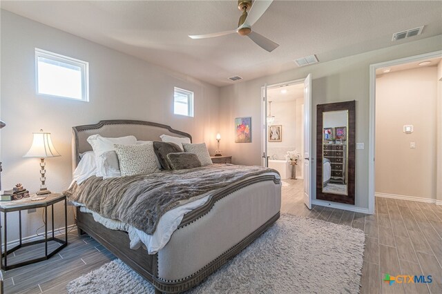 bedroom featuring ceiling fan and connected bathroom