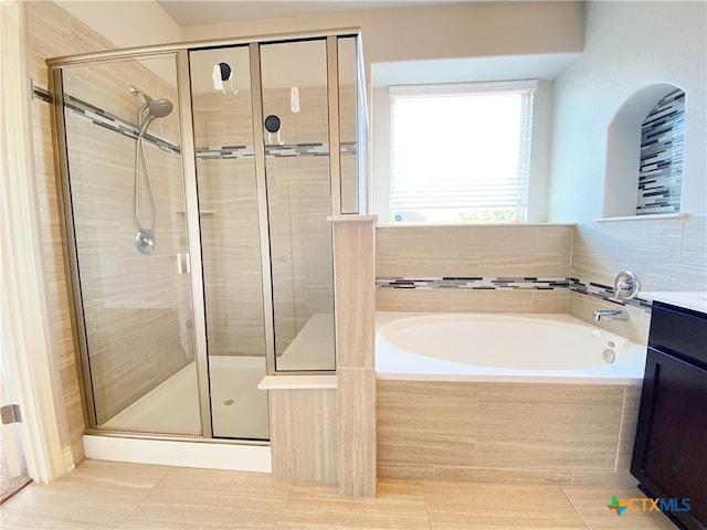 414 Field Corn Ln, San Marcos, TX 78666 - full bathroom with a bath, a shower stall, and tile patterned floors