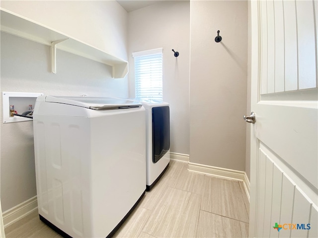 414 Field Corn Ln, San Marcos, TX 78666 - laundry room featuring independent washer and dryer and baseboards