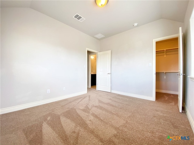 414 Field Corn Ln, San Marcos, TX 78666 - unfurnished bedroom featuring lofted ceiling, carpet, a walk in closet, and a closet