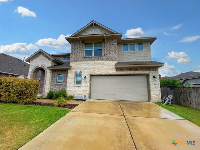 414 Field Corn Ln, San Marcos, TX 78666 - view of front of home featuring stone siding, an attached garage, and driveway