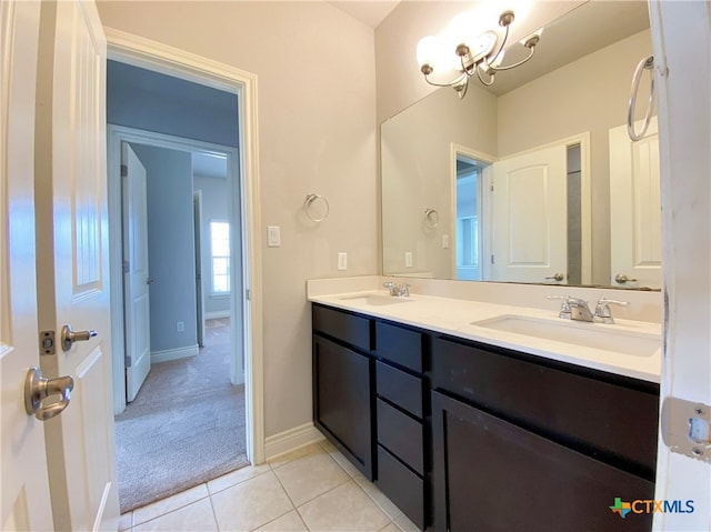 414 Field Corn Ln, San Marcos, TX 78666 - full bathroom featuring double vanity, tile patterned floors, and a chandelier