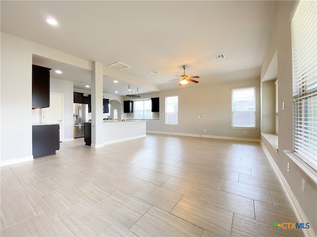 414 Field Corn Ln, San Marcos, TX 78666 - unfurnished living room with a ceiling fan and recessed lighting