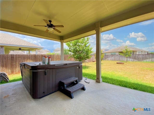 414 Field Corn Ln, San Marcos, TX 78666 - fenced backyard featuring a hot tub, a ceiling fan, and a patio