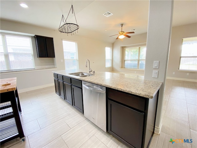 414 Field Corn Ln, San Marcos, TX 78666 - kitchen with dishwasher, ceiling fan, and light stone counters