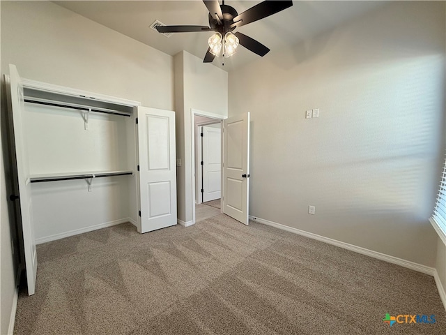 unfurnished bedroom with ceiling fan, a closet, and light colored carpet