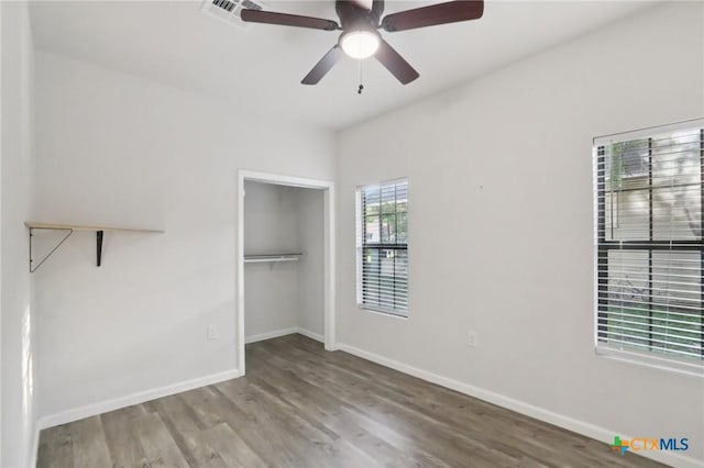 608 E 13th Ave, Belton, TX 76513 - unfurnished bedroom with wood finished floors, a closet, and ceiling fan