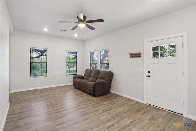 608 E 13th Ave, Belton, TX 76513 - living area featuring plenty of natural light, a ceiling fan, and wood finished floors