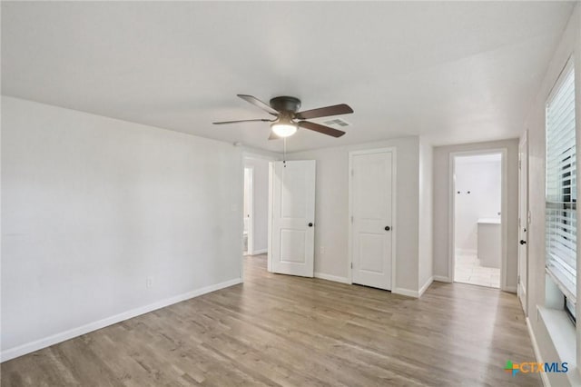 608 E 13th Ave, Belton, TX 76513 - unfurnished bedroom with wood finished floors and ceiling fan