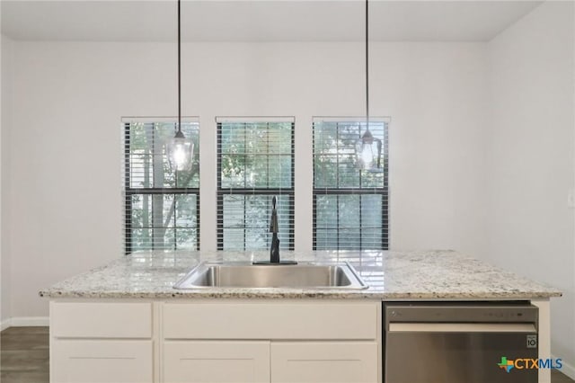 608 E 13th Ave, Belton, TX 76513 - kitchen with stainless steel dishwasher, light stone counters, white cabinets, and hanging light fixtures