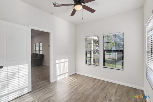 608 E 13th Ave, Belton, TX 76513 - spare room with wood finished floors and a ceiling fan