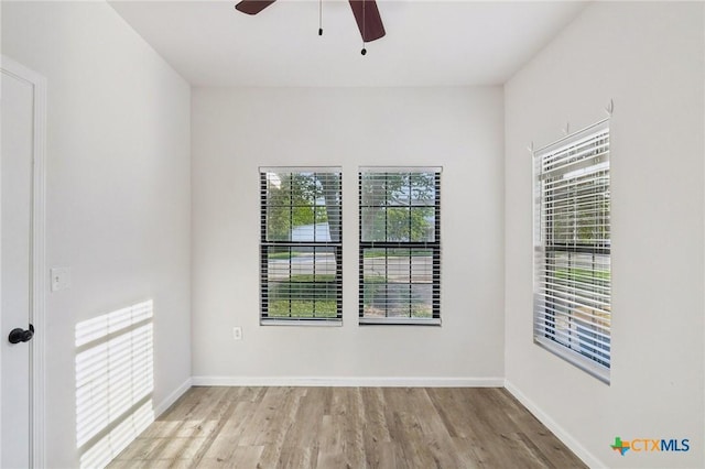 608 E 13th Ave, Belton, TX 76513 - empty room with ceiling fan and wood finished floors
