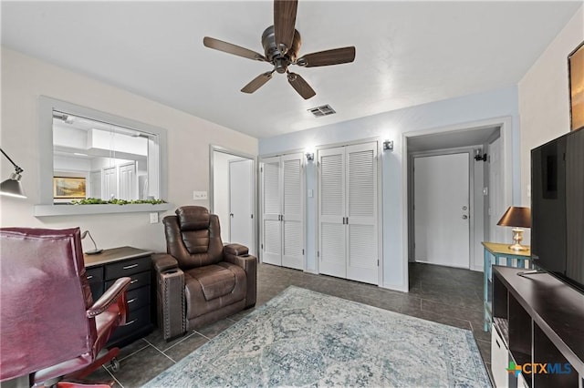 3921 Cripple Creek Dr, Temple, TX 76502 - home office featuring dark tile patterned flooring and ceiling fan