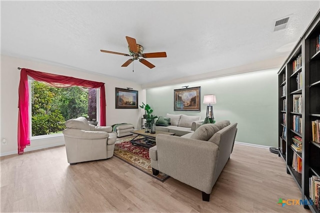 3921 Cripple Creek Dr, Temple, TX 76502 - living area with wood finished floors, a ceiling fan, and baseboards