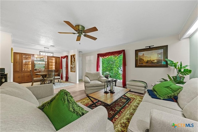 3921 Cripple Creek Dr, Temple, TX 76502 - living area with ceiling fan and light wood-style flooring