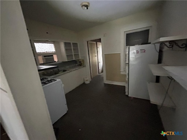 kitchen with white appliances and white cabinetry