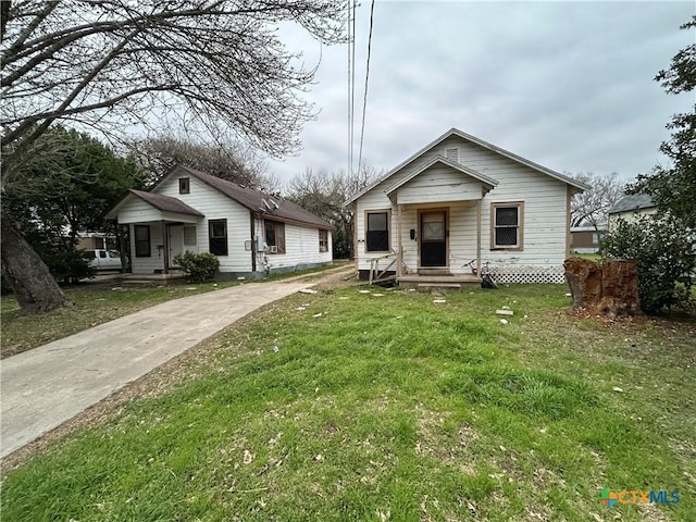 bungalow with a front lawn