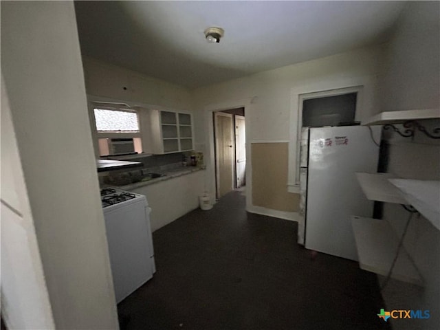 kitchen with white appliances and white cabinetry