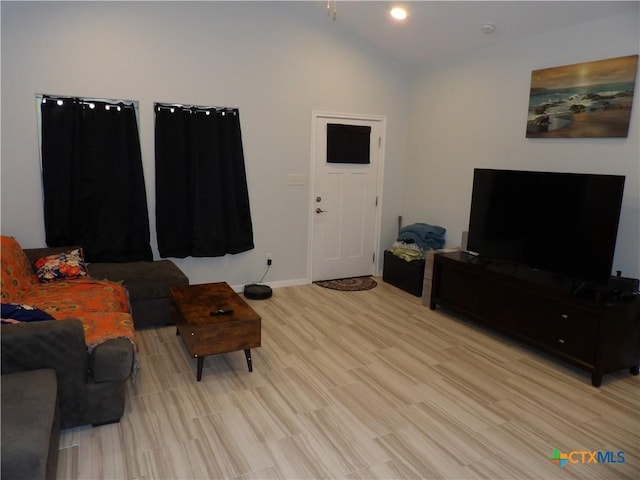 930 Redwood, Rockport, TX 78382 - living room with vaulted ceiling and light wood finished floors