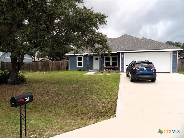 930 Redwood, Rockport, TX 78382 - single story home with concrete driveway, an attached garage, and a shingled roof