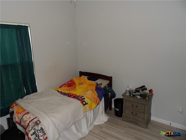 930 Redwood, Rockport, TX 78382 - bedroom with baseboards and wood finished floors