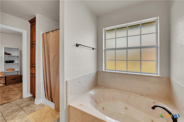 bathroom with tile patterned flooring, separate shower and tub, and a healthy amount of sunlight