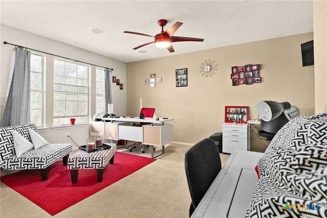 office space featuring ceiling fan and light colored carpet