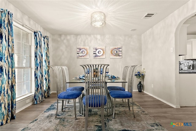 dining room with hardwood / wood-style flooring