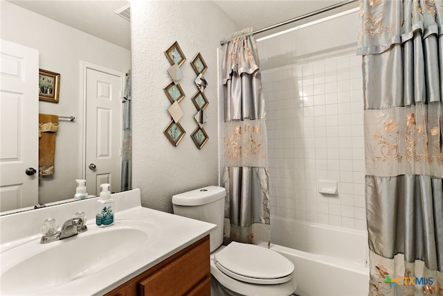 full bathroom featuring shower / bath combo, toilet, and vanity