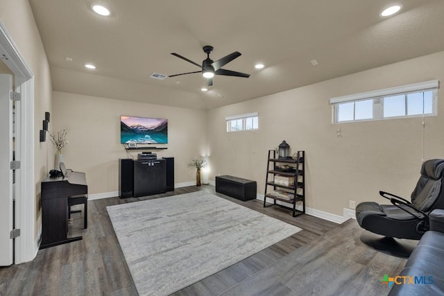 sitting room with dark wood-type flooring, recessed lighting, a ceiling fan, and visible vents