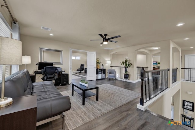 living area with visible vents, a ceiling fan, wood finished floors, recessed lighting, and baseboards