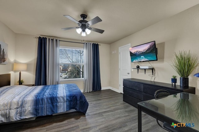 bedroom featuring wood finished floors, baseboards, and ceiling fan