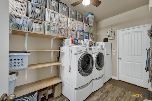 laundry area with washer and dryer, laundry area, wood finished floors, and a ceiling fan