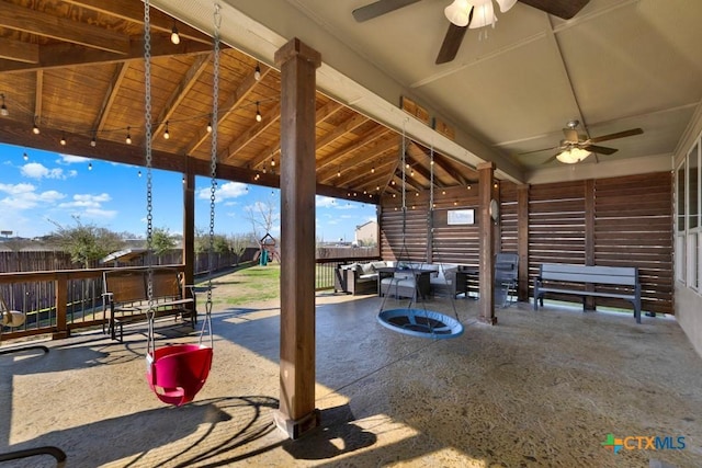 view of patio with outdoor dining area and a ceiling fan