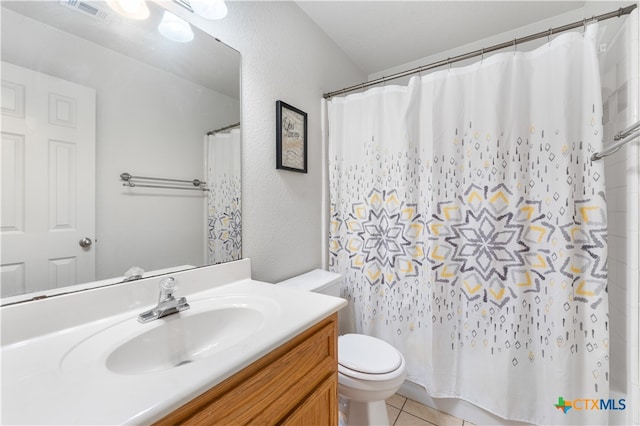 bathroom featuring tile patterned flooring, visible vents, curtained shower, toilet, and vanity