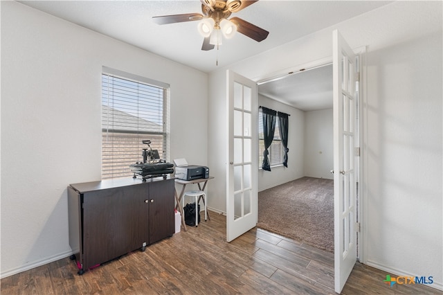 office area with a wealth of natural light, french doors, wood finished floors, and a ceiling fan