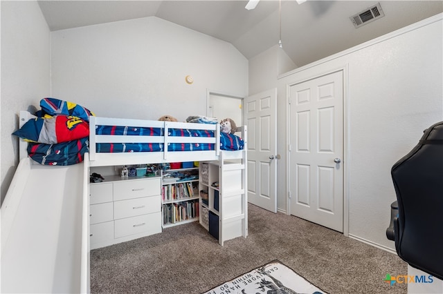 bedroom featuring a ceiling fan, lofted ceiling, carpet, and visible vents