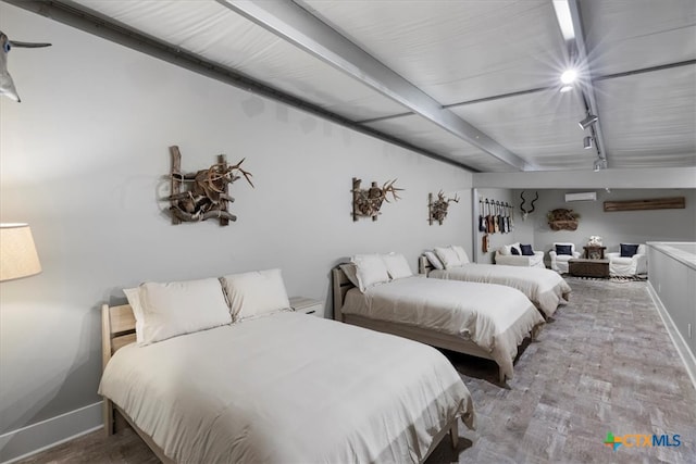 bedroom featuring light wood-type flooring and rail lighting