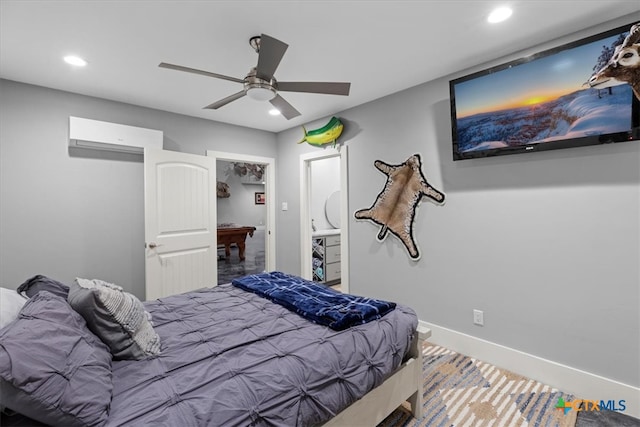 bedroom with ensuite bath, ceiling fan, and carpet floors